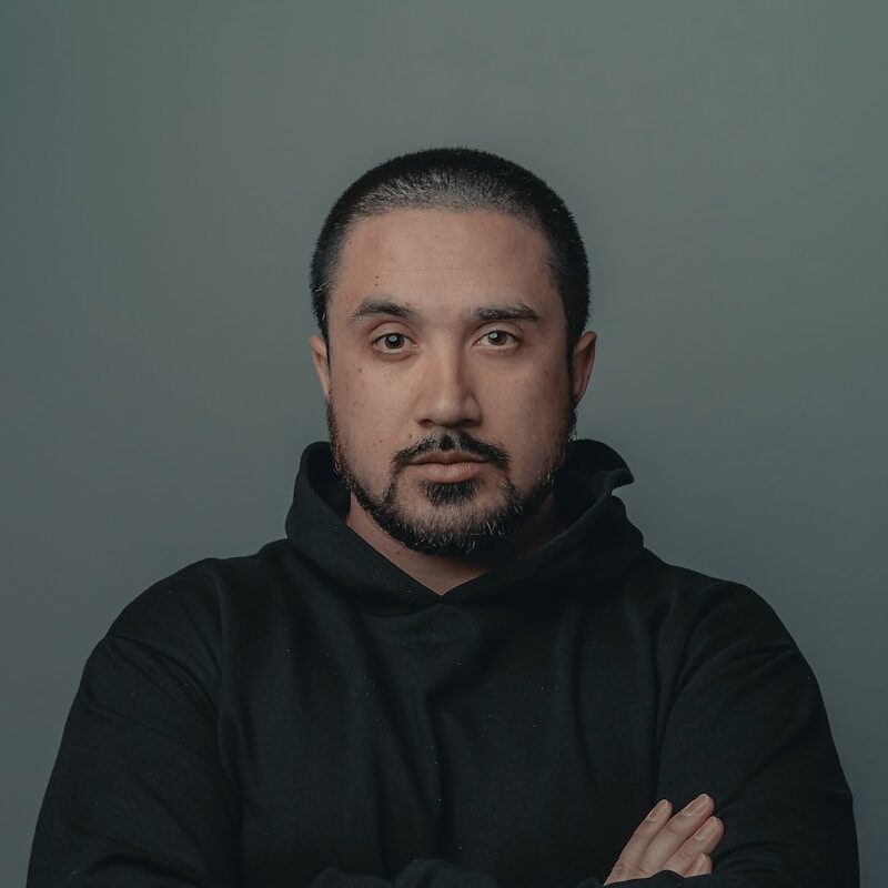 man in black hoodie standing