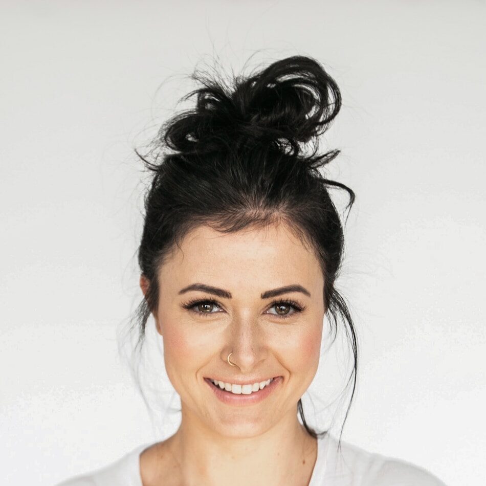 woman in white crew neck shirt smiling